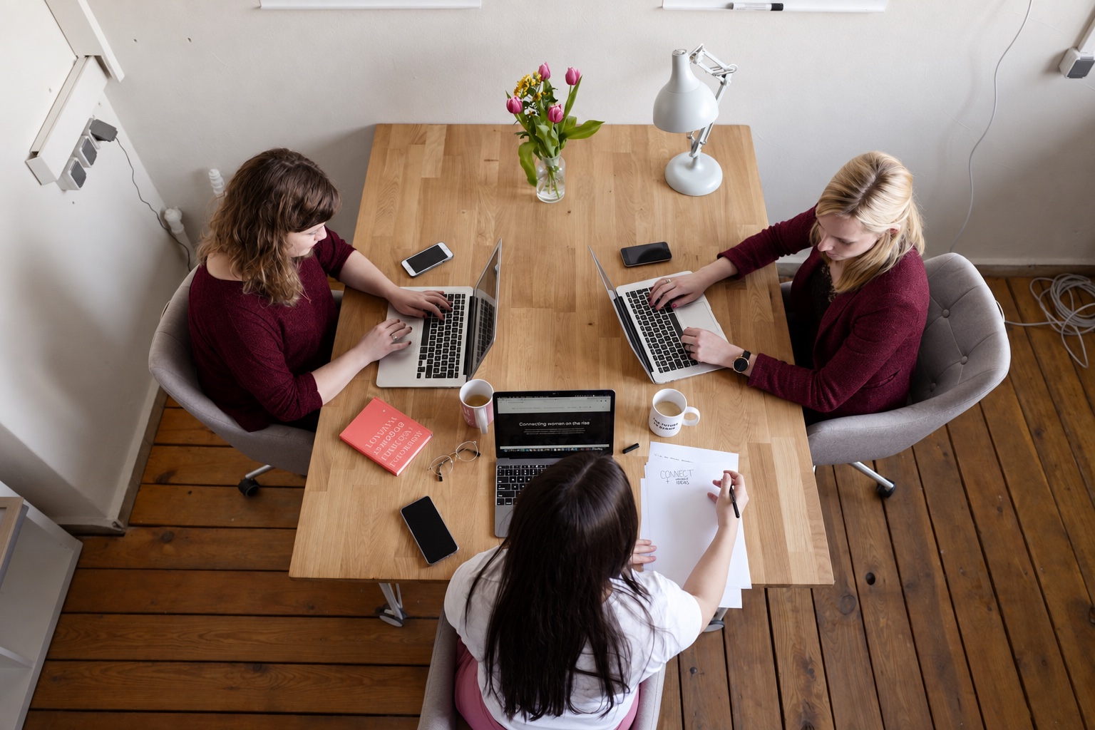 A small team working through their plans together